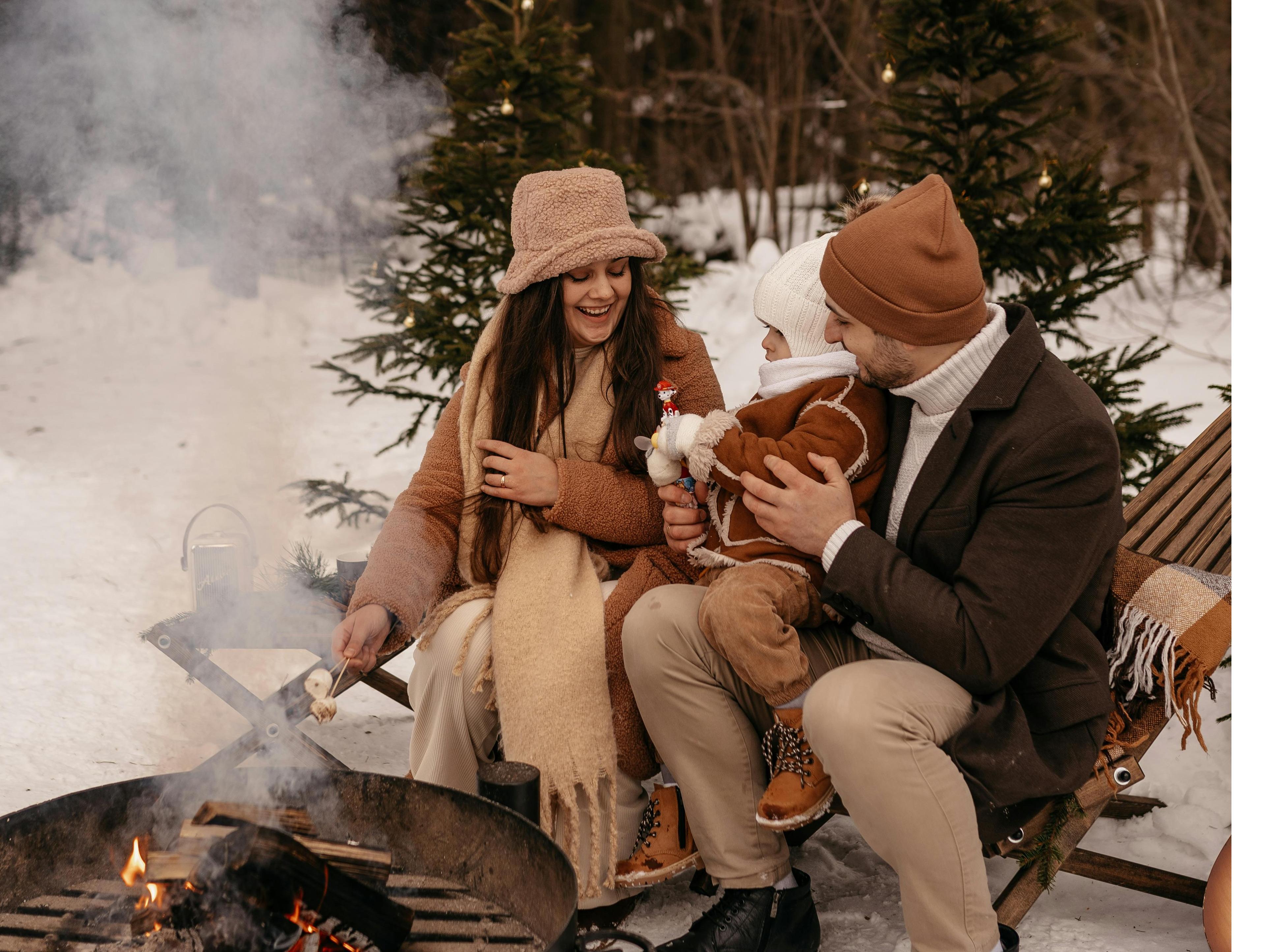 Family enjoy winter campfire